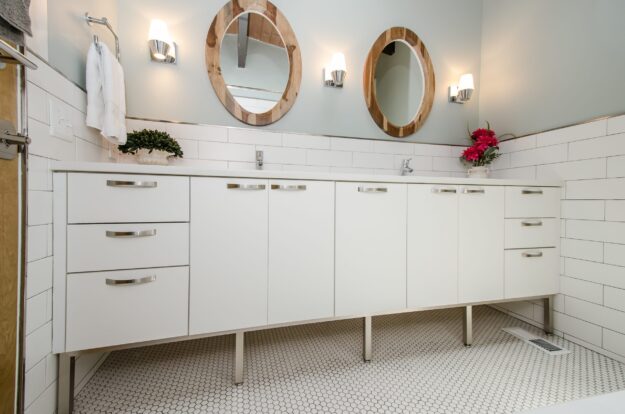 modern white double bowl bath vanity with two round mirrors and subway tile