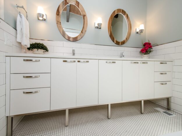 modern white double bowl bath vanity with two round mirrors and subway tile