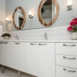modern white double bowl bath vanity with two round mirrors and subway tile