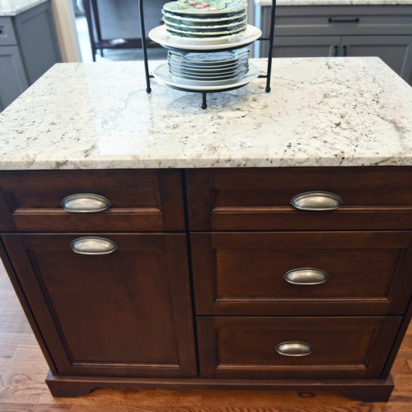 kitchen renovation with grey painted cabinets contrasting dark stained wood island luxury appliances