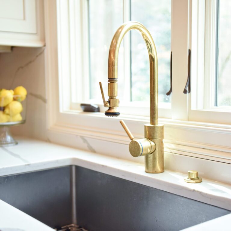 exquisite Atlanta kitchen renovation with custom white cabinets large island with seating and luxury appliances