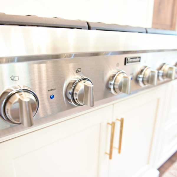 exquisite Atlanta kitchen renovation with custom white cabinets large island with seating and luxury appliances