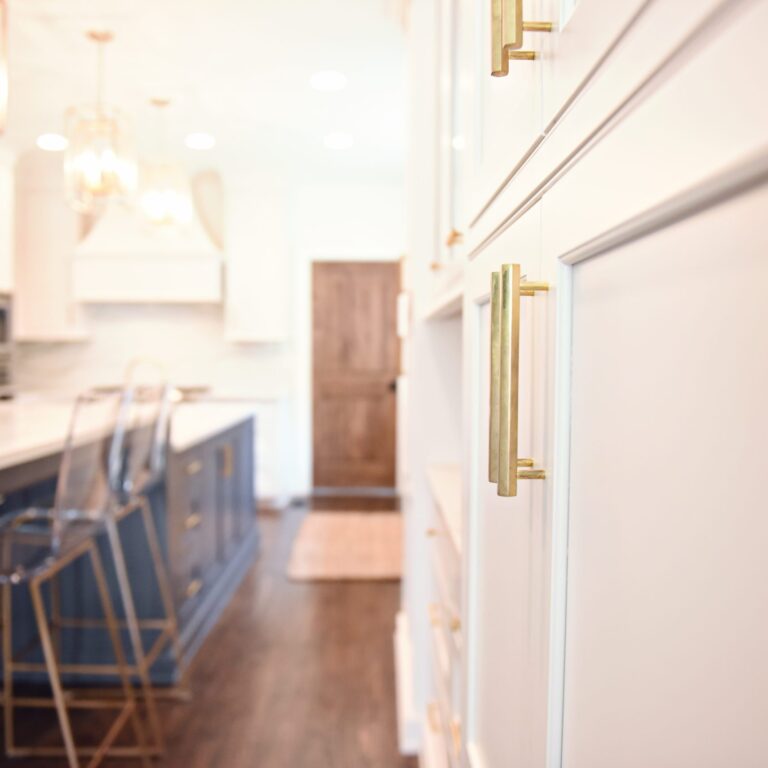 exquisite Atlanta kitchen renovation with custom white cabinets large island with seating and luxury appliances