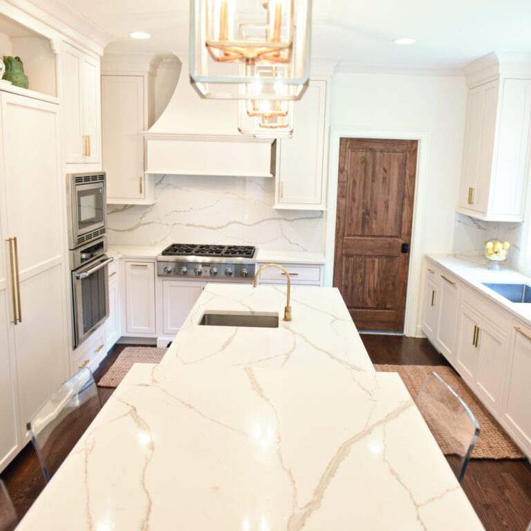 exquisite Atlanta kitchen renovation with custom white cabinets large island with seating and luxury appliances