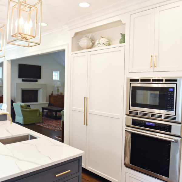 exquisite Atlanta kitchen renovation with custom white cabinets large island with seating and luxury appliances