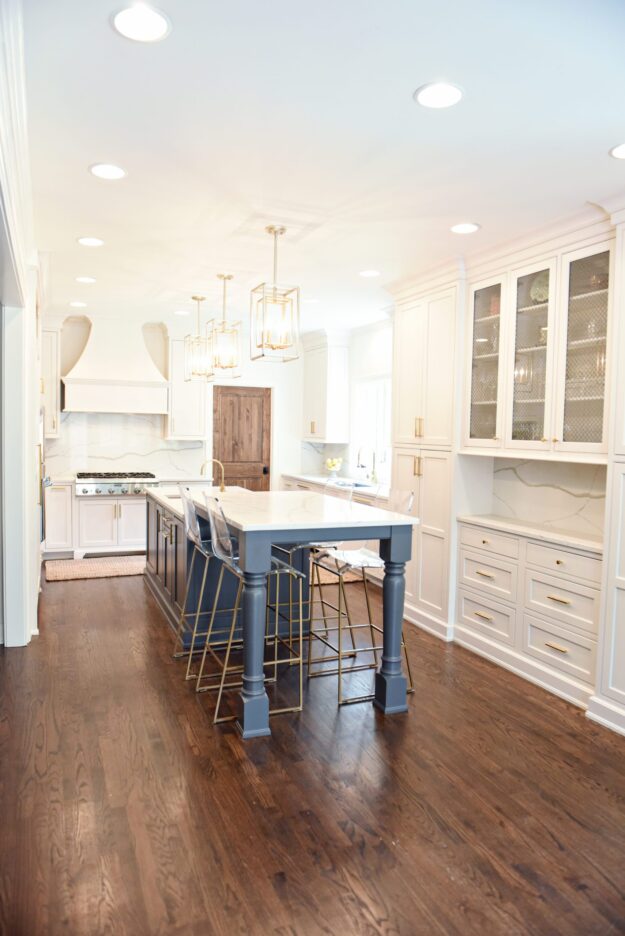 exquisite Atlanta kitchen renovation with custom white cabinets large island with seating and luxury appliances