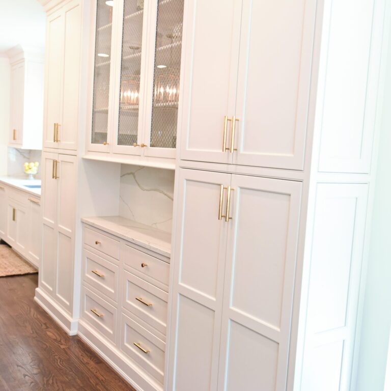 exquisite Atlanta kitchen renovation with custom white cabinets large island with seating and luxury appliances