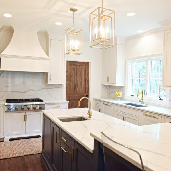 exquisite Atlanta kitchen renovation with custom white cabinets large island with seating and luxury appliances