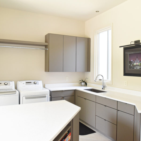 custom laundry room cabinets to maximize every inch of storage space