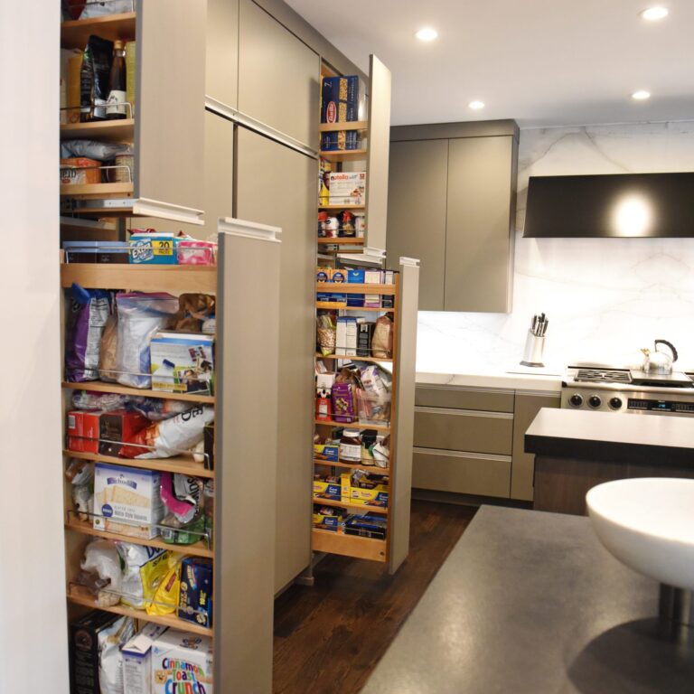 kitchen renovation with modern grey cabinets and dark wood cabinets featuring two islands and luxury appliances including two dishwashers