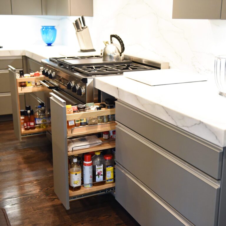 kitchen renovation with modern grey cabinets and dark wood cabinets featuring two islands and luxury appliances including two dishwashers