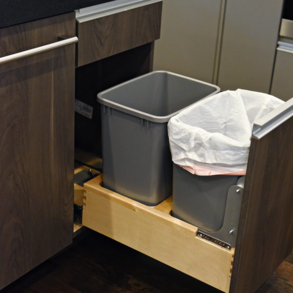 kitchen renovation with modern grey cabinets and dark wood cabinets featuring two islands and luxury appliances including two dishwashers