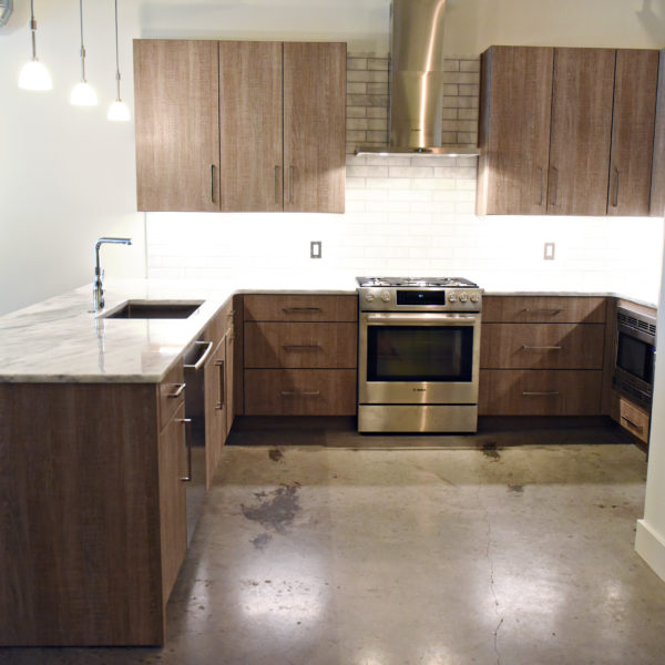 modern kitchen design in loft building with industrial ceiling