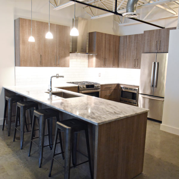 modern kitchen design in loft building with industrial ceiling