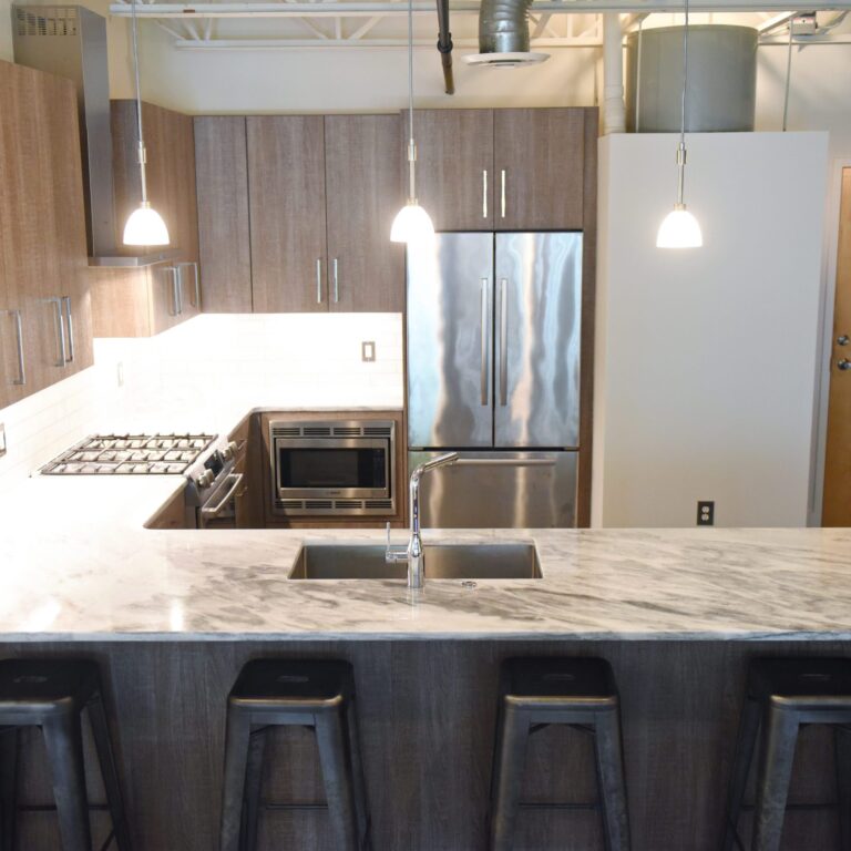 modern kitchen design in loft building with industrial ceiling