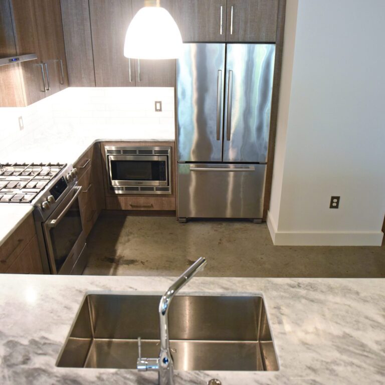 modern kitchen design in loft building with industrial ceiling