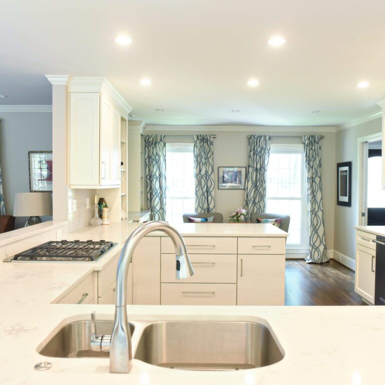 Atlanta area kitchen transformation with white cabinets luxury appliances breakfast nook and custom storage tower and pantry cabinets