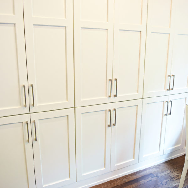 Atlanta area kitchen transformation with white cabinets luxury appliances breakfast nook and custom storage tower and pantry cabinets