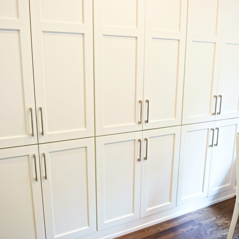 Atlanta area kitchen transformation with white cabinets luxury appliances breakfast nook and custom storage tower and pantry cabinets