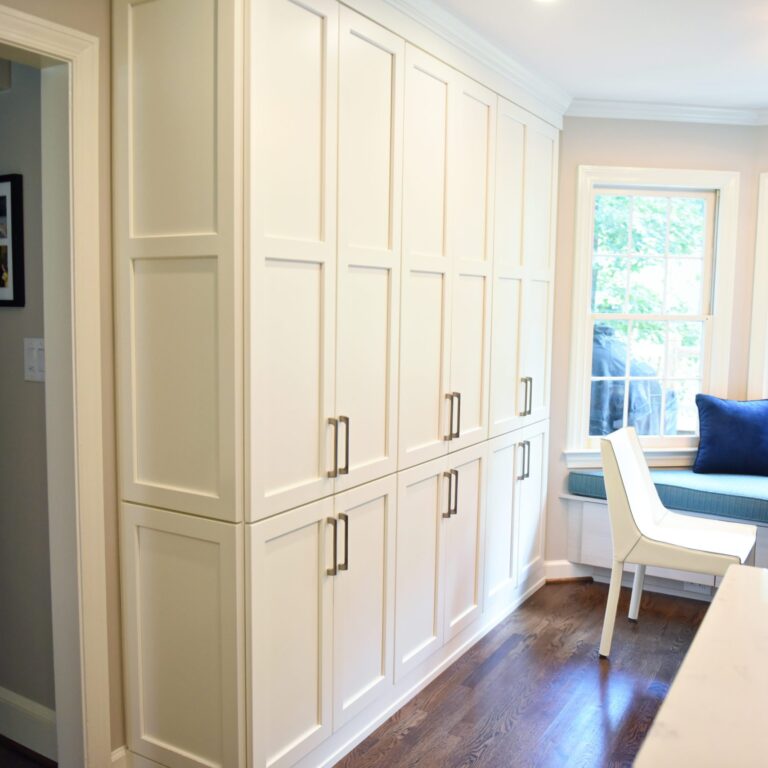 Atlanta area kitchen transformation with white cabinets luxury appliances breakfast nook and custom storage tower and pantry cabinets