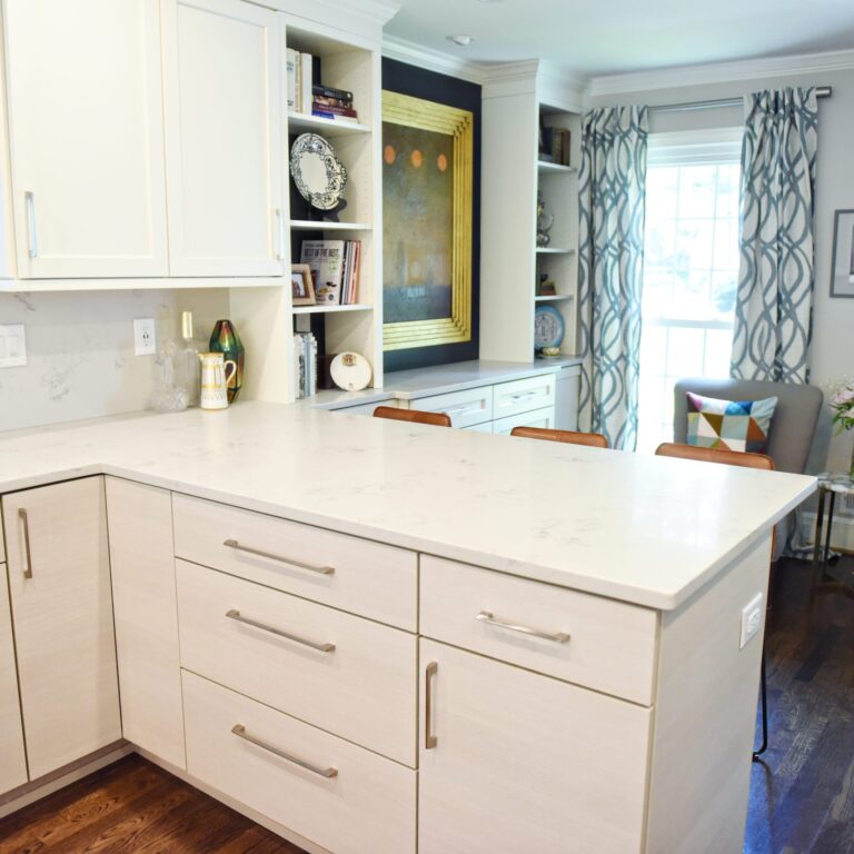 Atlanta area kitchen transformation with white cabinets luxury appliances breakfast nook and custom storage tower and pantry cabinets