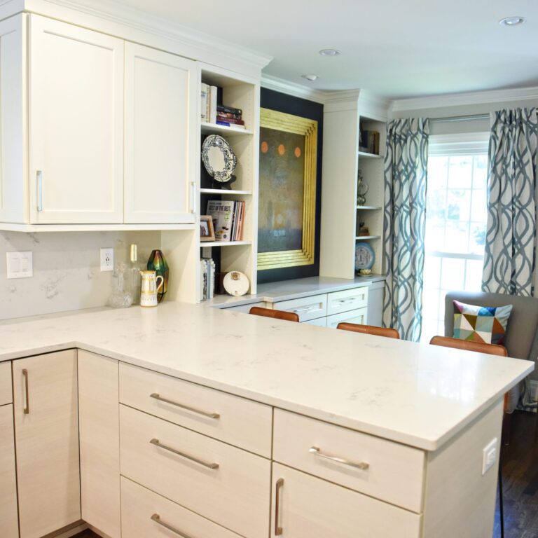 Atlanta area kitchen transformation with white cabinets luxury appliances breakfast nook and custom storage tower and pantry cabinets