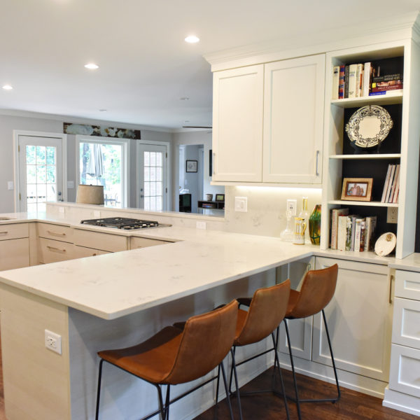 Atlanta area kitchen transformation with white cabinets luxury appliances breakfast nook and custom storage tower and pantry cabinets