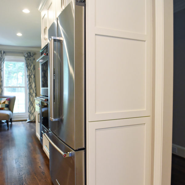 Atlanta area kitchen transformation with white cabinets luxury appliances breakfast nook and custom storage tower and pantry cabinets
