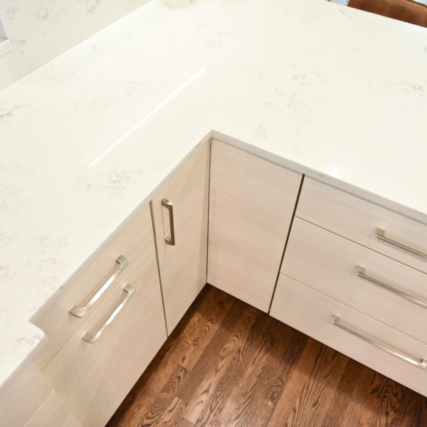 Atlanta area kitchen transformation with white cabinets luxury appliances breakfast nook and custom storage tower and pantry cabinets