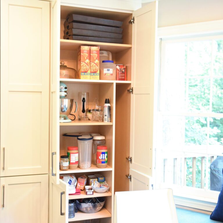 Atlanta area kitchen transformation with white cabinets luxury appliances breakfast nook and custom storage tower and pantry cabinets