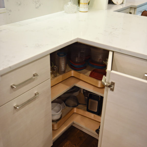 Atlanta area kitchen transformation with white cabinets luxury appliances breakfast nook and custom storage tower and pantry cabinets