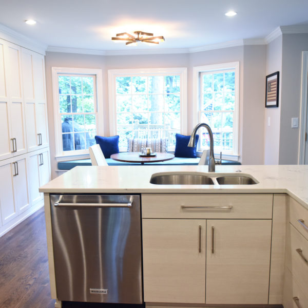 Atlanta area kitchen transformation with white cabinets luxury appliances breakfast nook and custom storage tower and pantry cabinets