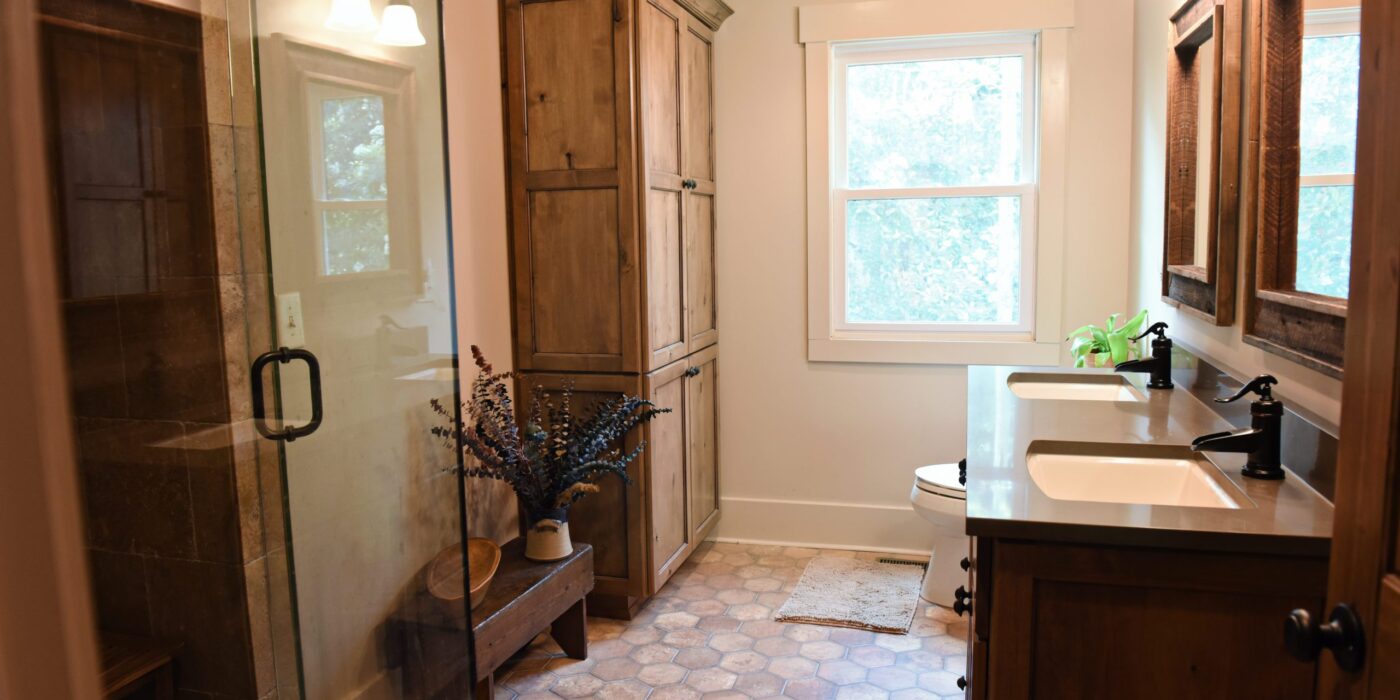 Rustic retreat bathroom design modern mountain cabin bathroom with walk-in shower double vanity and large storage tower cabinet