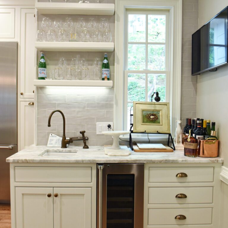 transitional Atlanta kitchen with white cabinets grey island luxury stainless steel appliances farmhouse sink