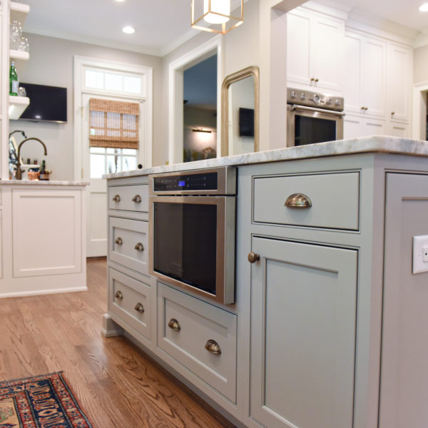 transitional Atlanta kitchen with white cabinets grey island luxury stainless steel appliances farmhouse sink