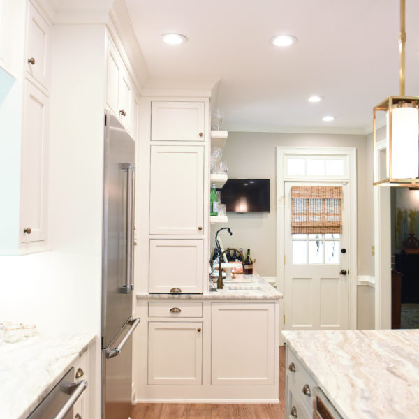 transitional Atlanta kitchen with white cabinets grey island luxury stainless steel appliances farmhouse sink