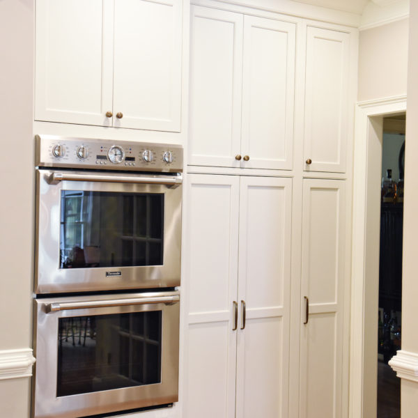 transitional Atlanta kitchen with white cabinets grey island luxury stainless steel appliances farmhouse sink