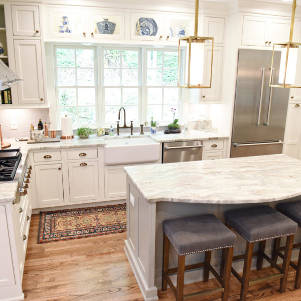 transitional Atlanta kitchen with white cabinets grey island luxury stainless steel appliances farmhouse sink