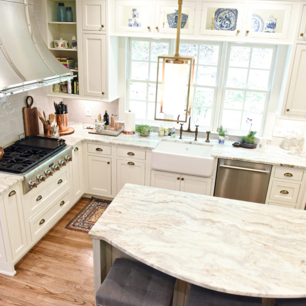 transitional Atlanta kitchen with white cabinets grey island luxury stainless steel appliances farmhouse sink