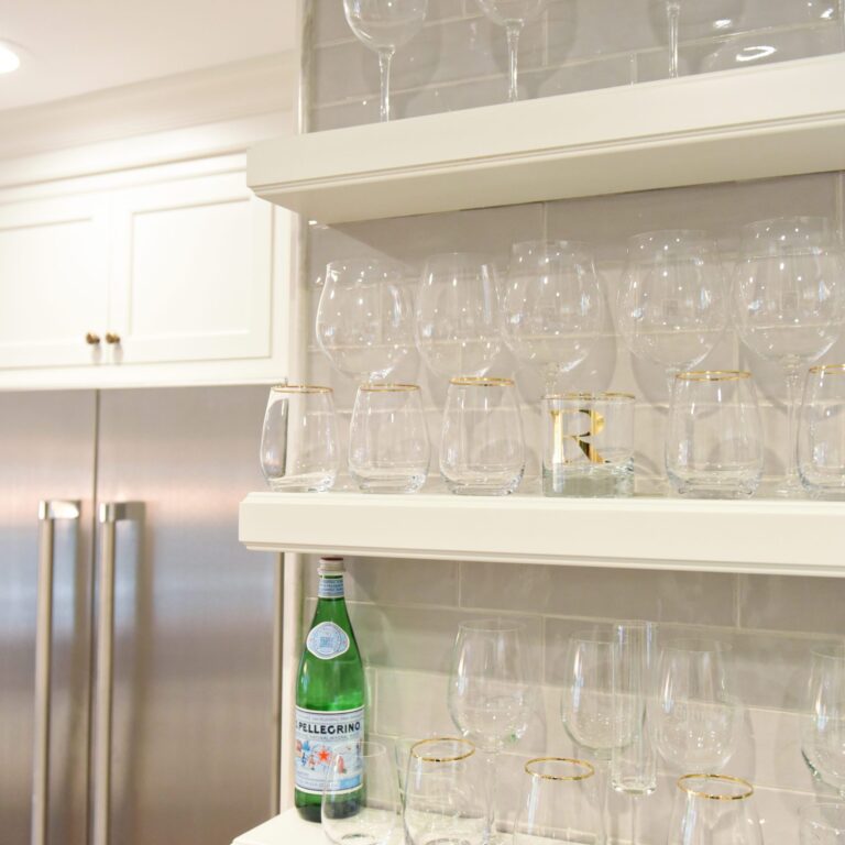transitional Atlanta kitchen with white cabinets grey island luxury stainless steel appliances farmhouse sink