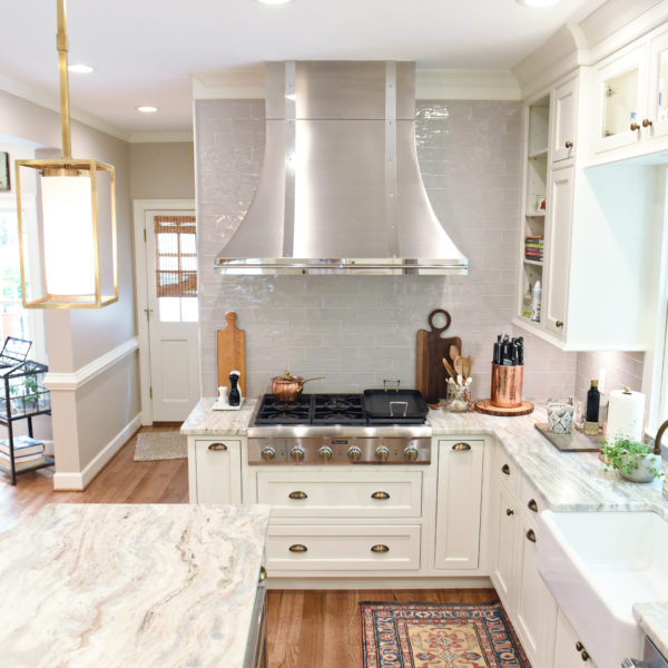 transitional Atlanta kitchen with white cabinets grey island luxury stainless steel appliances farmhouse sink