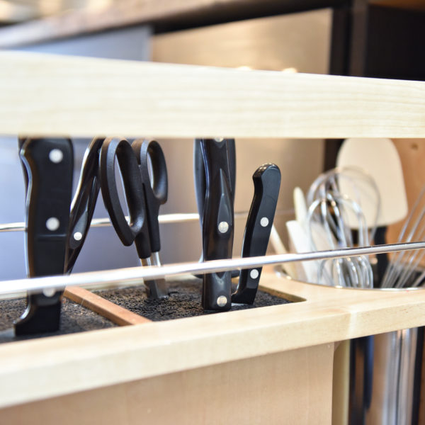 modern Atlanta kitchen design with dark contemporary lower cabinets and lighter upper cabinets with large island and luxury stainless steel appliances