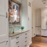 elegant transitional kitchen with white cabinets subway tile dark island stainless steel appliances farmhouse sink