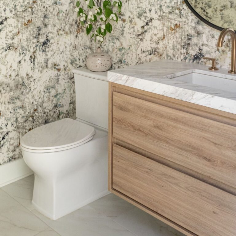 picture of floating vanity and toilet in powder room with wallpaper on the walls