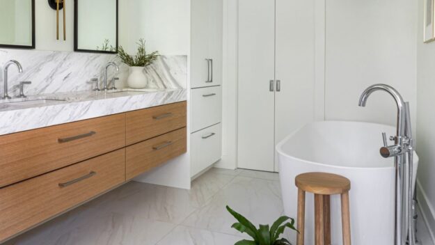 this spa-like Atlanta bath renovation features a soaking tub walk-in shower custom floating cabinets and custom storage tower