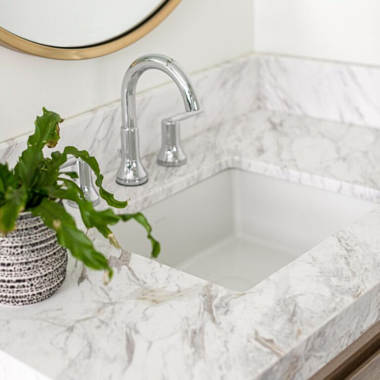 close up of vanity top with square sink and silver faucet