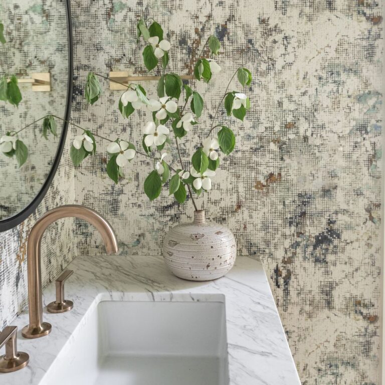 close up of vanity counter with wallpaper in background