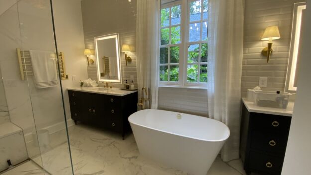luxurious bathroom remodel with soaking tub, double vanities, large walk-in shower and heated towel rack