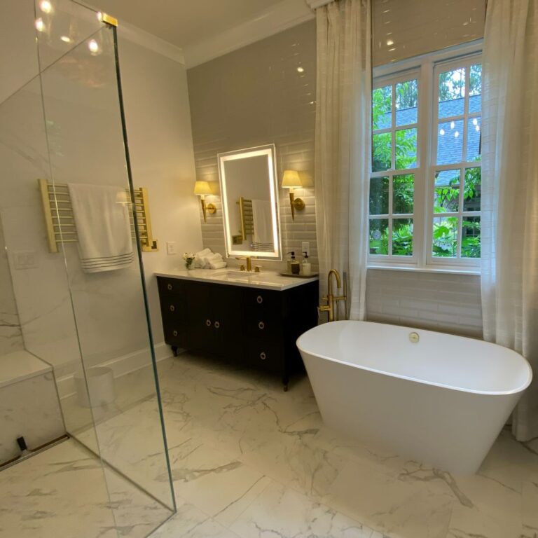 luxury bathroom renovation with soaking tub, two vanities, walk-in shower and towel warmer