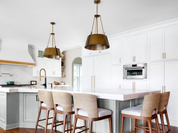 picture of seating area around kitchen island in a beautifully renovated kitchen in a Marietta, GA home featuring custom cabinets by Schuon Kitchens & Baths